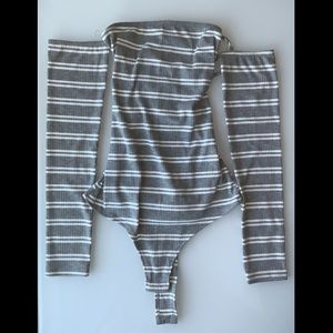 White and grey long sleeve striped body suit with an open back